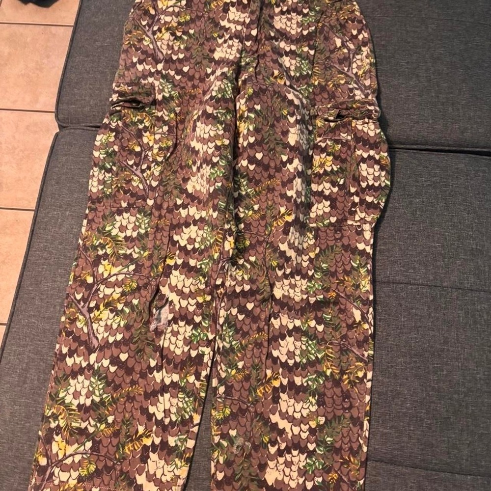Brown and green camouflage pants with heart-shaped leaf pattern